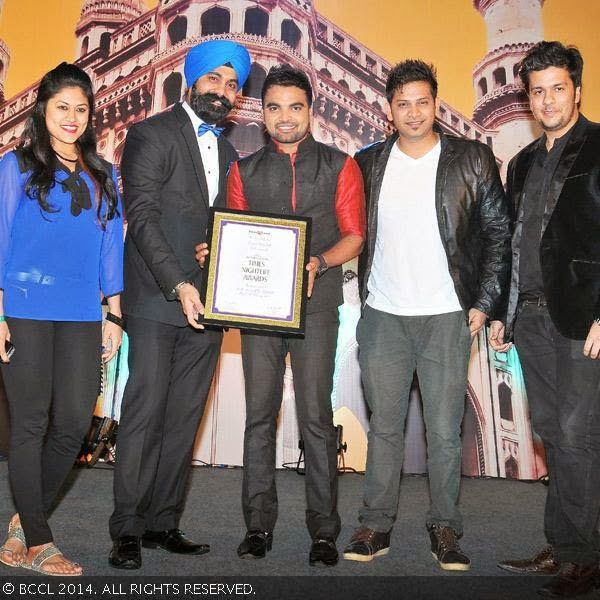 Pradeep presents Best Night Club award to the team of Kismet at The Times Food & Nightlife Guide, Hyderabad and Secunderabad, 2014 held at HICC,Madhapur in Hyderabad.