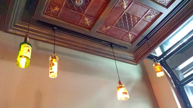 First National Taphouse in Portland, the back area has the most privacy, with less tables, still access to a TV, and these lovely light fixtures of various liquor bottles
