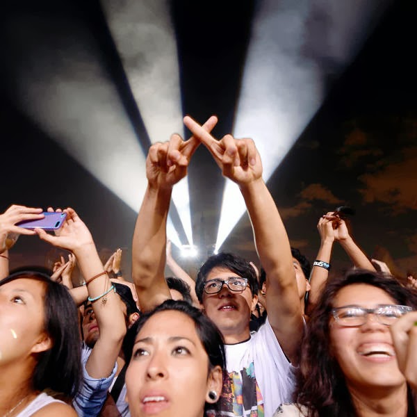 Music fans enjoy British band The XX performing during the the first Day of Corona Capital Music Fest at the Autodromo Hernmanos Rodriguez, in Mexico City, on October 12, 2013.