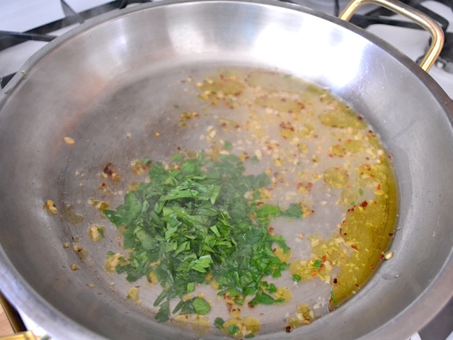 pasta water and parsley added to skillet 