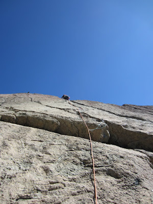 Sara leading the first pitch.  After checking out the large crack on the face, she went straight up the smaller cracks above our belay ledge.  She placed a couple cams before topping out on the ledge to continue on.