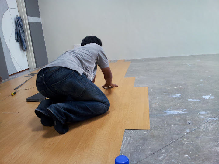 laying wooden flooring