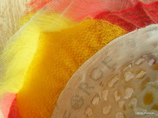 partially hand-tied, then glued, crepe wool wig.
