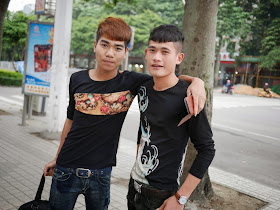two young men wearing shirts with creative designs in Zhanjiang