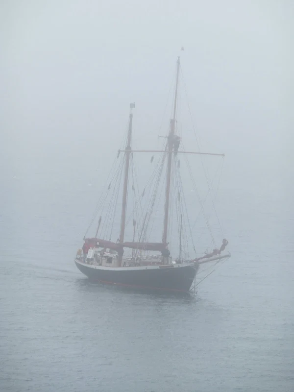 J-Class yacht lurking in the fog