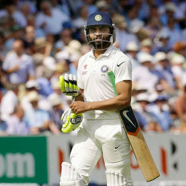 India's Ravindra Jadeja leaves the field after being bowled LBW by England's Moeen Ali during the first day of the second test match between England and India at Lord's cricket ground in London, Thursday, July 17, 2014