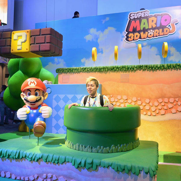 Fans enjoy the Nintendo Super Mario 3D Worlds display at the E3 Gaming and Technology Conference at the Los Angeles Convention Center on June 11, 2013.