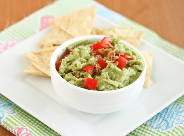 photo of a bowl guacamole with chips