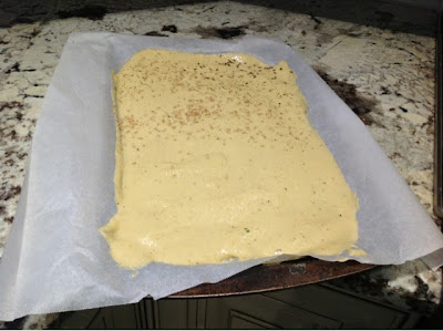 plantain batter shaped on a cookie sheet for baking for flatbread