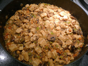 making chicken fricassee, adding wine and water and chik'n and beginning the stew part