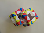 Interlocked cubes using "Open Frame I -- Bow-tie Motif" units from Tomoko Fuse's "Multidimensional Transformations: Unit Origami", page 62.