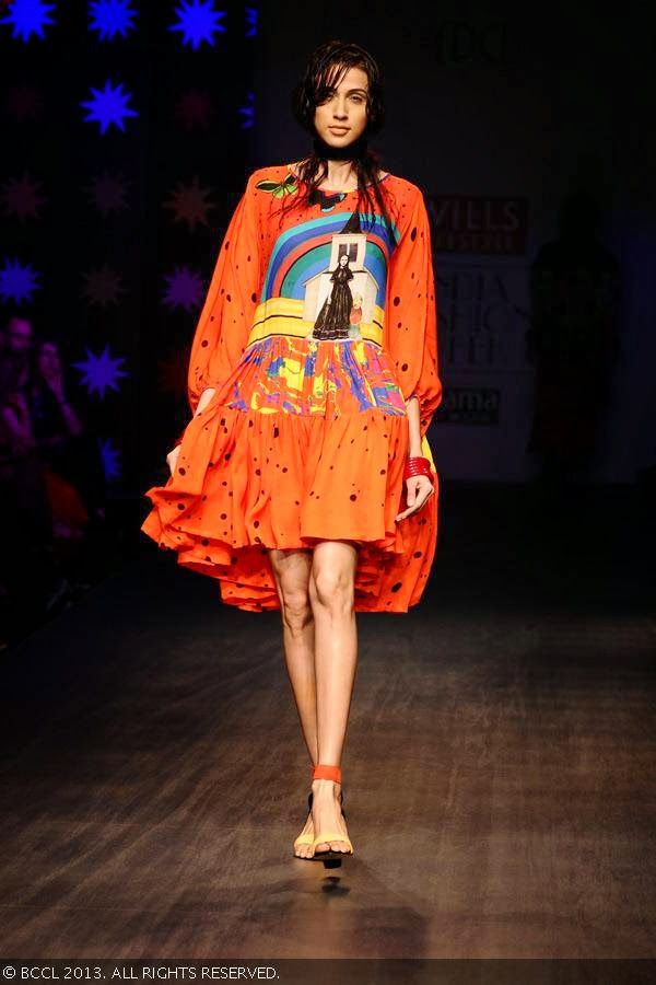 A model showcases a creation by designer duo Anna Plunkett and Luke Sales on Day 1 of Wills Lifestyle India Fashion Week (WIFW) Spring/Summer 2014, held in Delhi.