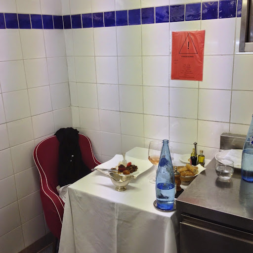 Table for one, in the kitchen at the chefs, Mougins. From 100 Places in France Every Woman Should Go 