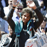 Spain's Rafael Nadal waves as he leaves the court after wining against Spain's David Ferrer their semifinal tennis match of the French Open tennis tournament at the Roland Garros stadium, on June 8, 2012 in Paris.      AFP PHOTO / PASCAL GUYOT        (Photo credit should read PASCAL GUYOT/AFP/GettyImages)