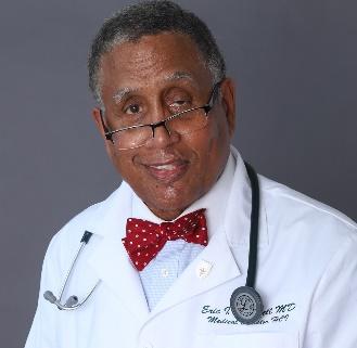 A doctor with a stethoscope around his neck

Description automatically generated