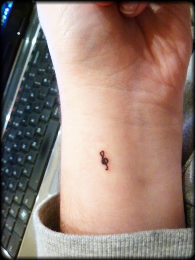 small music symbol & tattoo on wrist