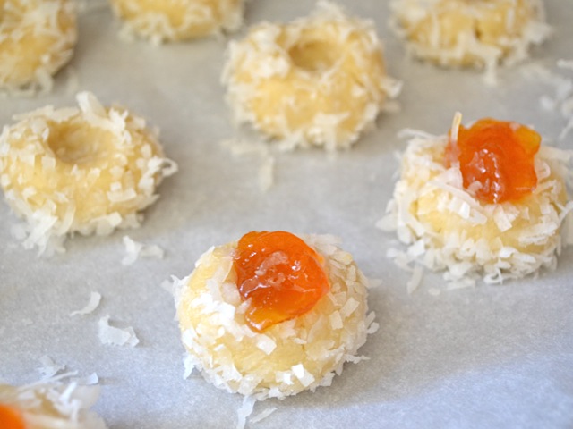 dress cookies (balls of dough dipped in egg white, then coconut flakes and then a dollop of jam on top)