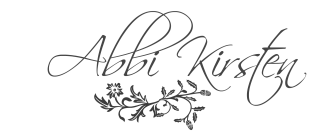 "Abbi Kirsten" is written in script font to resemble a signature. There are decorative floral leaves underneath. 