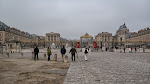 Walking the long plaza to the palace gates of Versailles