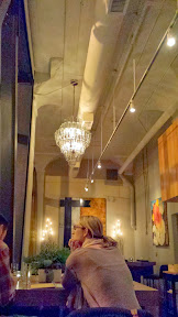 Wine bottle chandeliers hanging inside Remedy Wine Bar, Portland Oregon