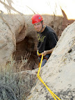 Chris rappelling to the geocache