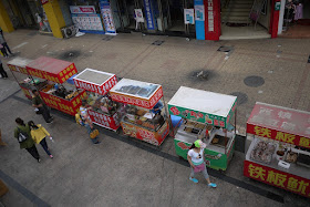 row of street food stalls