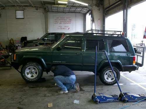 Lifting he Jeep to remove the transfer case.