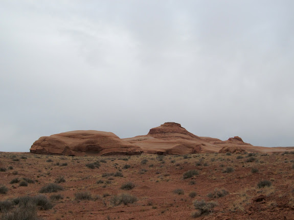 Sandstone buttes rising from the flat desert