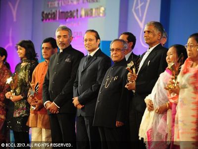 President Pranab Mukherjee with Vineet Jain, Times Group MD, and Bollywood director Prakash Jha during the Times of India Social Impact Awards, being given to changemakers within NGOs, corporates and the government who have quietly worked to transform the lives of millions of marginalized Indians.