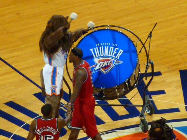 The Oklahoma City Thunder mascot dunks the ball during a stoppage in play  against the Houston Rockets at Chesapeake Energy Arena.