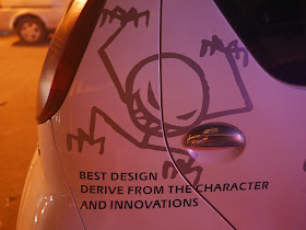 car with design of a stick figure monster and the words "Best design derive from the character and innovations"