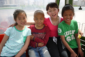 four kids in a cable car in Lanzhou, Gansu