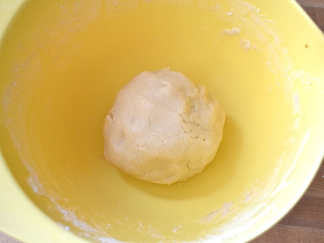 flour and salt mixed in with wet ingredients and formed into dough ball 