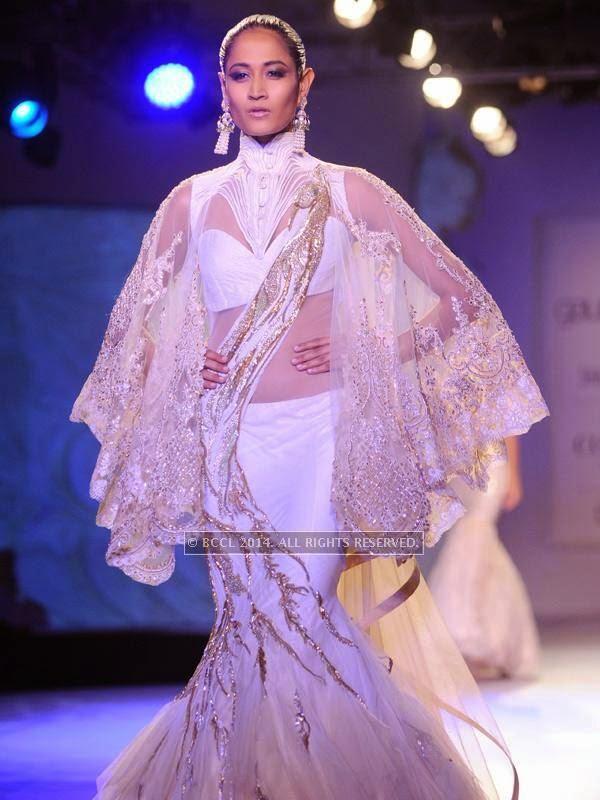 A model showcases a creation by designer Gaurab Gupta on Day 3 of India Couture Week, 2014, held at Taj Palace hotel, New Delhi.