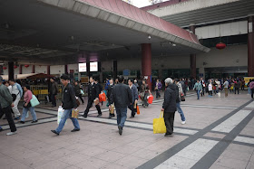 people exiting the Macau border control building in Zhuhai
