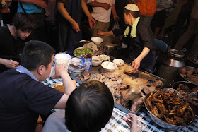 serving a variety of lamb parts at Zhengning Street Night Market in Lanzhou, China