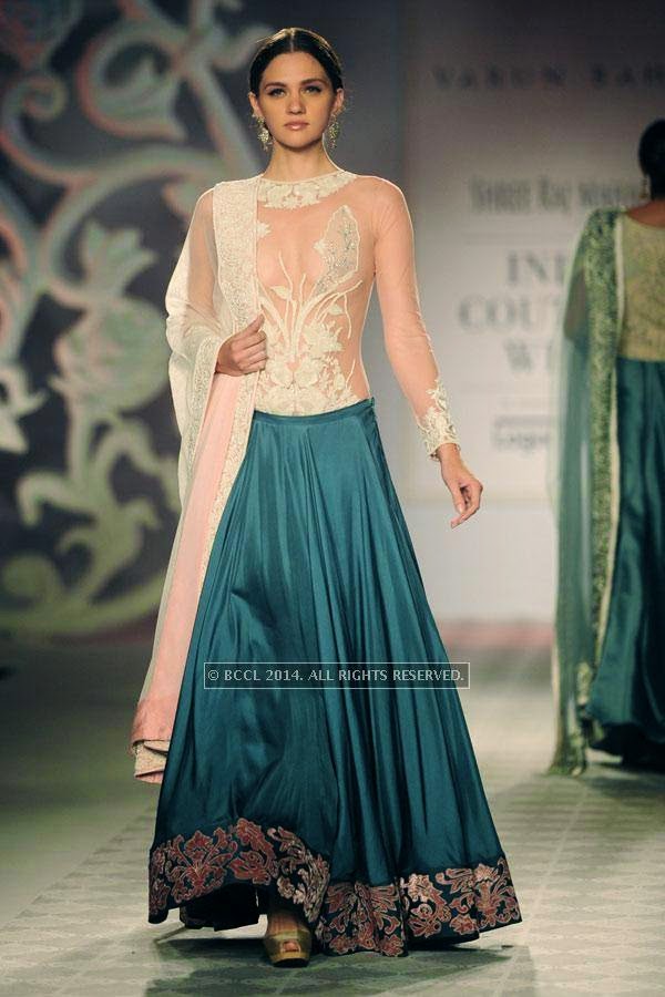 A model walks the ramp for Varun Bahl walks the ramp on Day 3 of India Couture Week, 2014, held at Taj Palace hotel, New Delhi.<br /> 