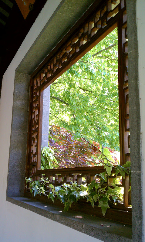 View of a window frame, it looks like a painting.