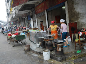 woman cooking outside in Hengyang