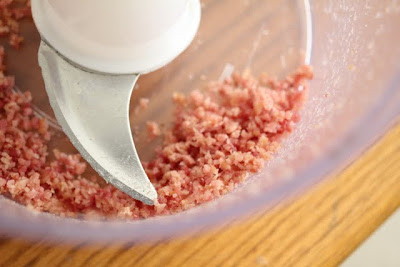 photo of chopped bacon in a food processor