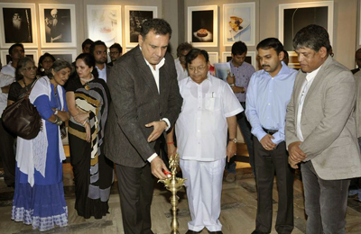 Actor Boman Irani lights the auspicious light during a photo exhibition, held at Tao art gallery in Mumbai on February 1, 2013. (Pic: Viral Bhayani)