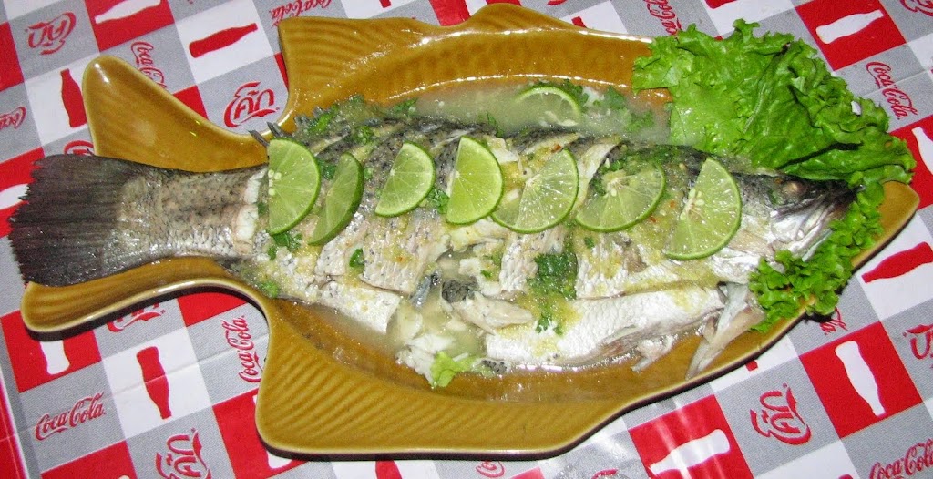Whole steamed fish. From A Complete Guide to Feeding Kids in Thailand