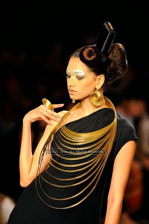 A model showcases a creation by NID on Day 3 of India International Jewellery Week (IIJW), 2014 at Grand Hyatt, Mumbai.