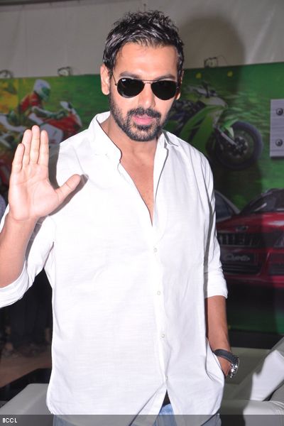 B'wood's sexy hunk John Abraham gestures towards the camera at Mumbai Internation Motor Show, held at BKC in Mumbai on January 24, 2013. (Pic: Viral Bhayani) 