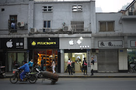 mobile phone store with prominent Apple and Android logs on its sign in Changsha, China