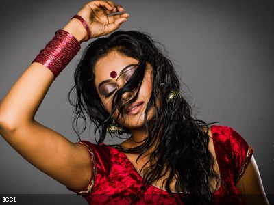 Tamil actress Arundhati poses akin a sensual trance during a photoshoot.