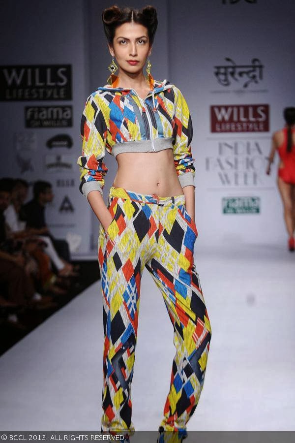 Sanea Sheikh showcases a creation by fashion designer Yogesh Chaudhary on Day 4 of Wills Lifestyle India Fashion Week (WIFW) Spring/Summer 2014, held in Delhi.