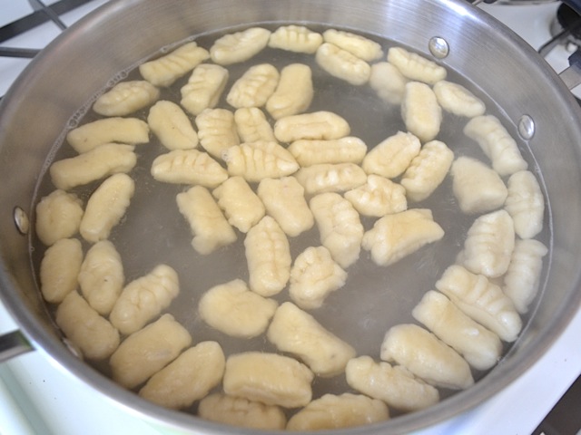 floating gnocchi in pot of water 
