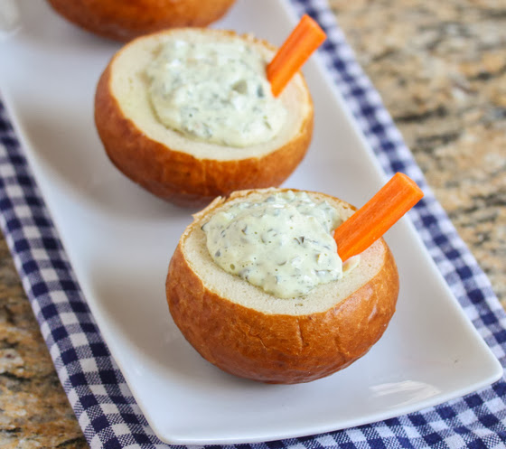 overhead photo of two Individual Spinach Dip Pretzel Bread Bowls