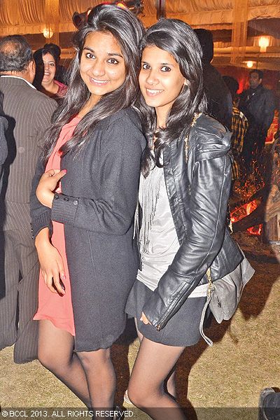 Harsha (L) and Ishani pose for the cameras during a new year bash, held at a club in Lucknow. 